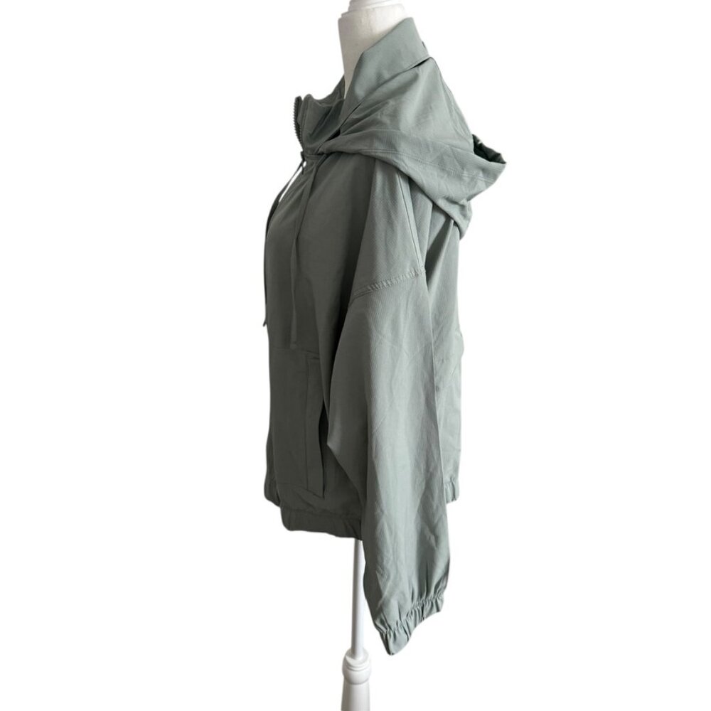 Eddie Bauer NWOT Green Windbreaker Hidden Hood Zipper Jacket Athletic apparel M - Picture 3 of 10